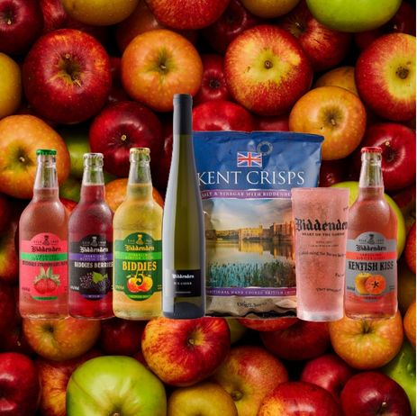 Assorted drinks and snacks with apples in the background